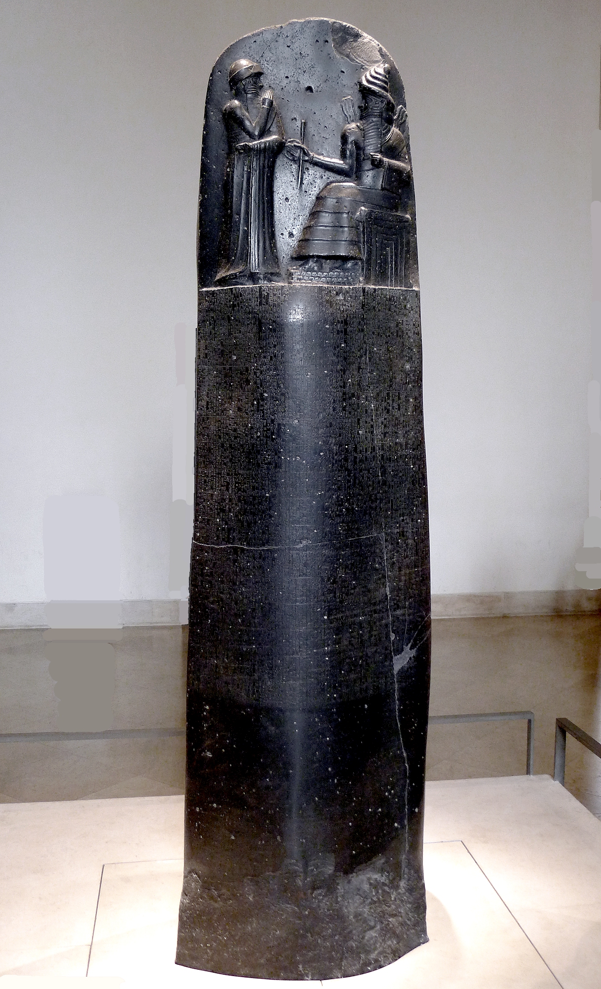 The Code of Hammurabi (c. 1755–1750 BCE), Louvre — laws carved in cuneiform on stone, the first numbered articles.