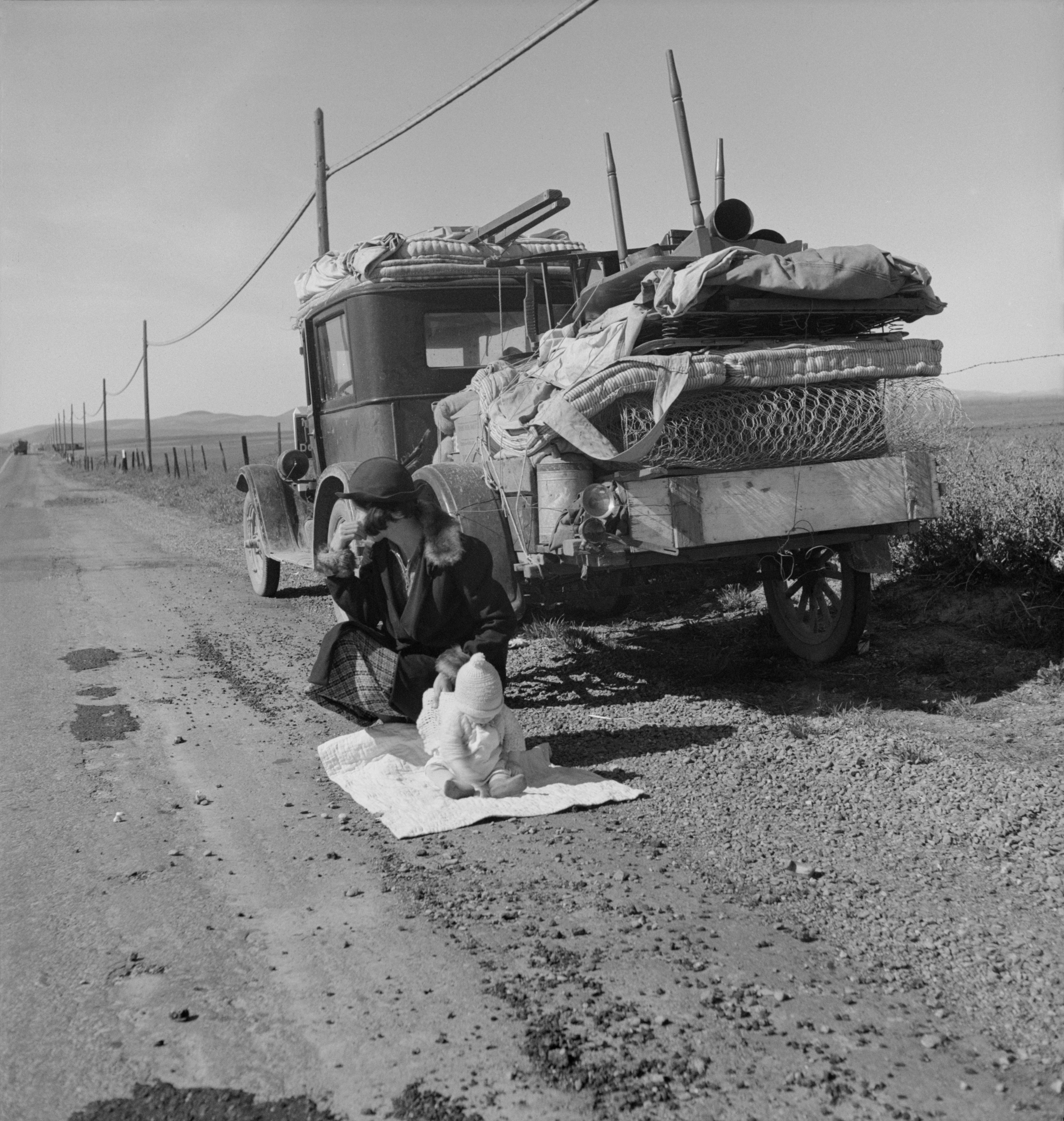 Dorothea Lange, 'Broke, baby sick, and car trouble!' — a Missouri family near Tracy, California (FSA, 1937), depression-era working life documented.